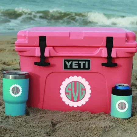 A pink Yeti cooler with a mongram on it