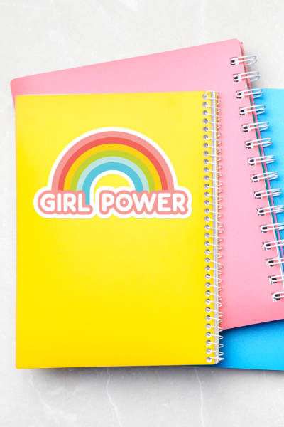 Girl Power sticker on yellow notebook