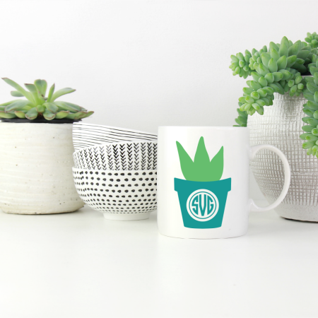 White coffee mug with an image of a monogrammed potted cactus