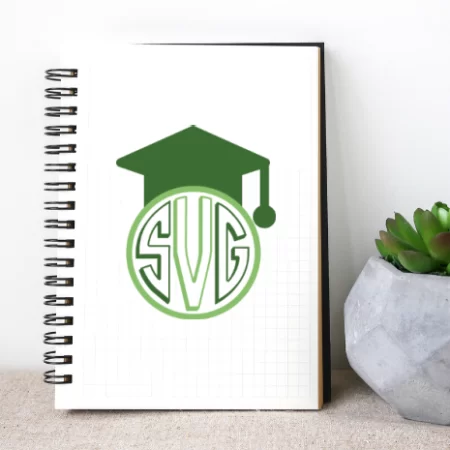 A notebook with a graduation monogram on it