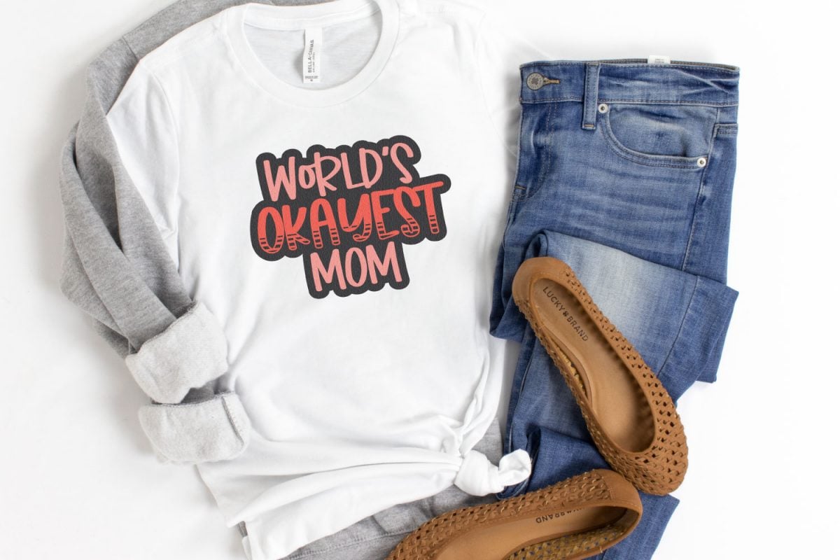 White shirt with the saying Okayest Mom on it