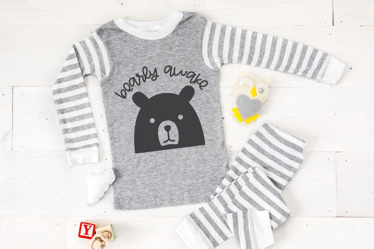Bearly Awake SVG on gray pajamas with baby toys