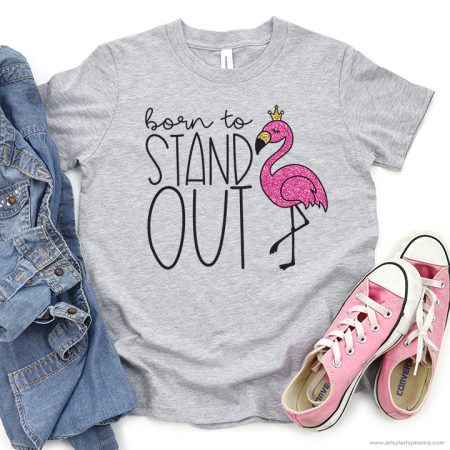 Gray t-shirt with an image of a pink flamingo and the saying Born to Stand Out