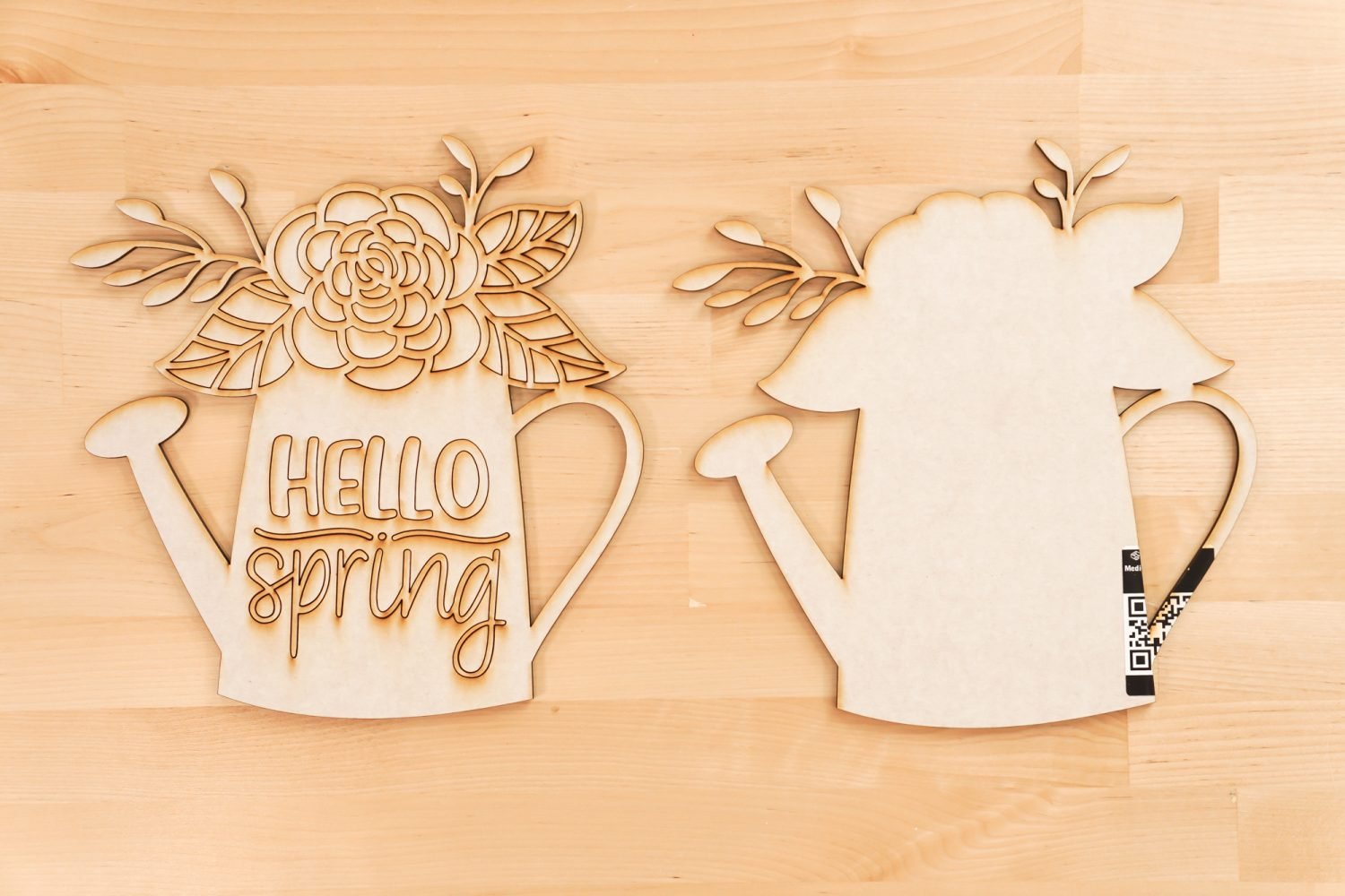 Pieces of the Hello Spring file cut on the Glowforge