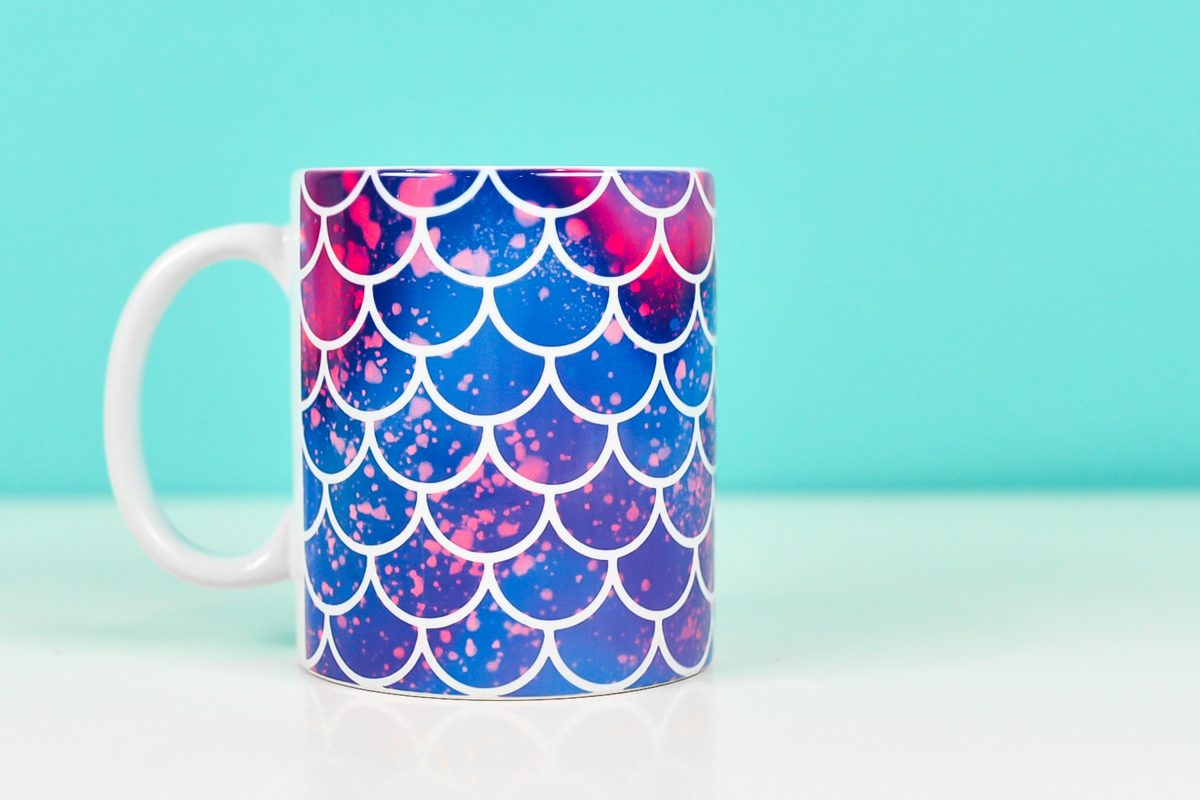 Mermaid mug on teal background made with mermaid mug wrap design