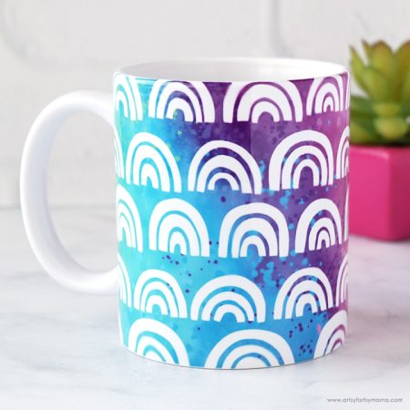 White mug decorated with Rainbows