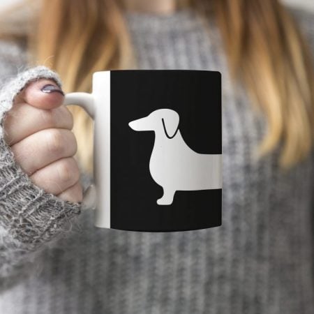 Coffee cup decorated with a weiner dog
