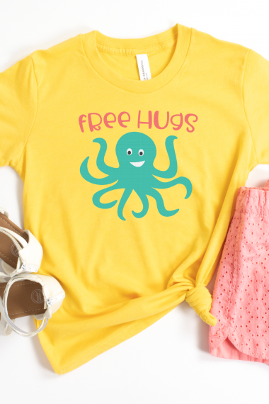 Free Hugs SVG on Yellow Shirt with Pink shorts and sandals