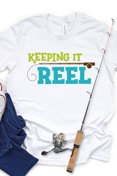 Keeping it Reel SVG on White Shirt with jeans and fishing rod