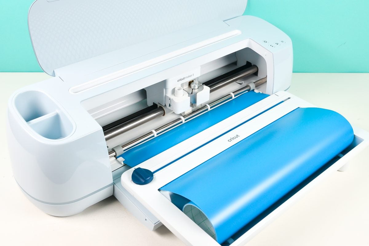 Cricut Maker 3 with Roll Holder attached -- shot at an angle