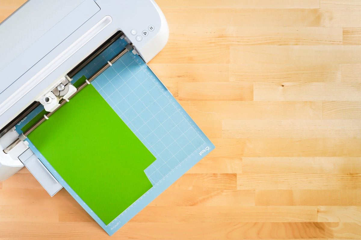 Cricut Maker cutting green vinyl