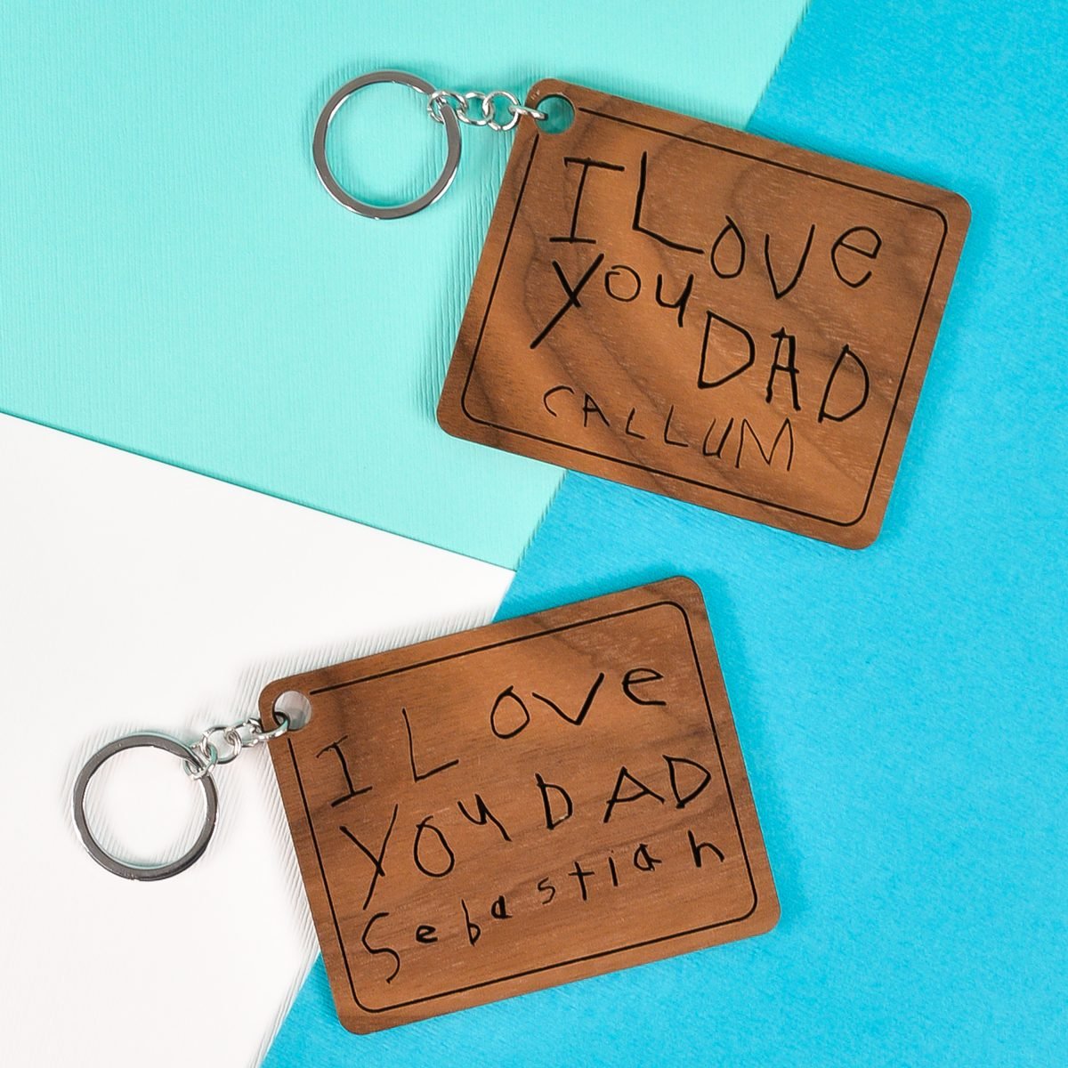 Finished keychains with child's handwriting made on a Glowforge