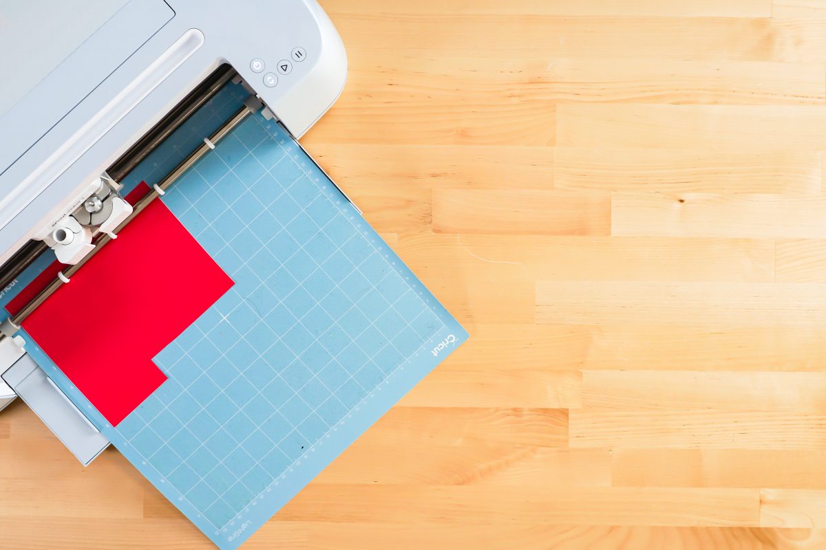 Cricut Maker cutting red vinyl