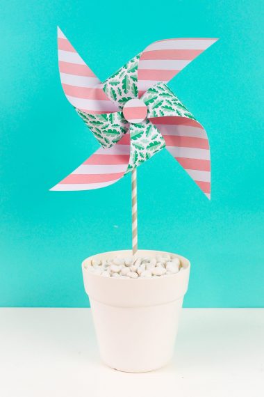 Final paper pinwheel on a teal background
