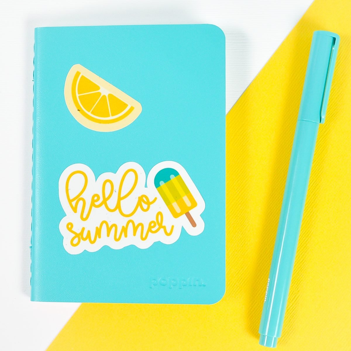 Blue notebook with summer stickers on white and yellow background