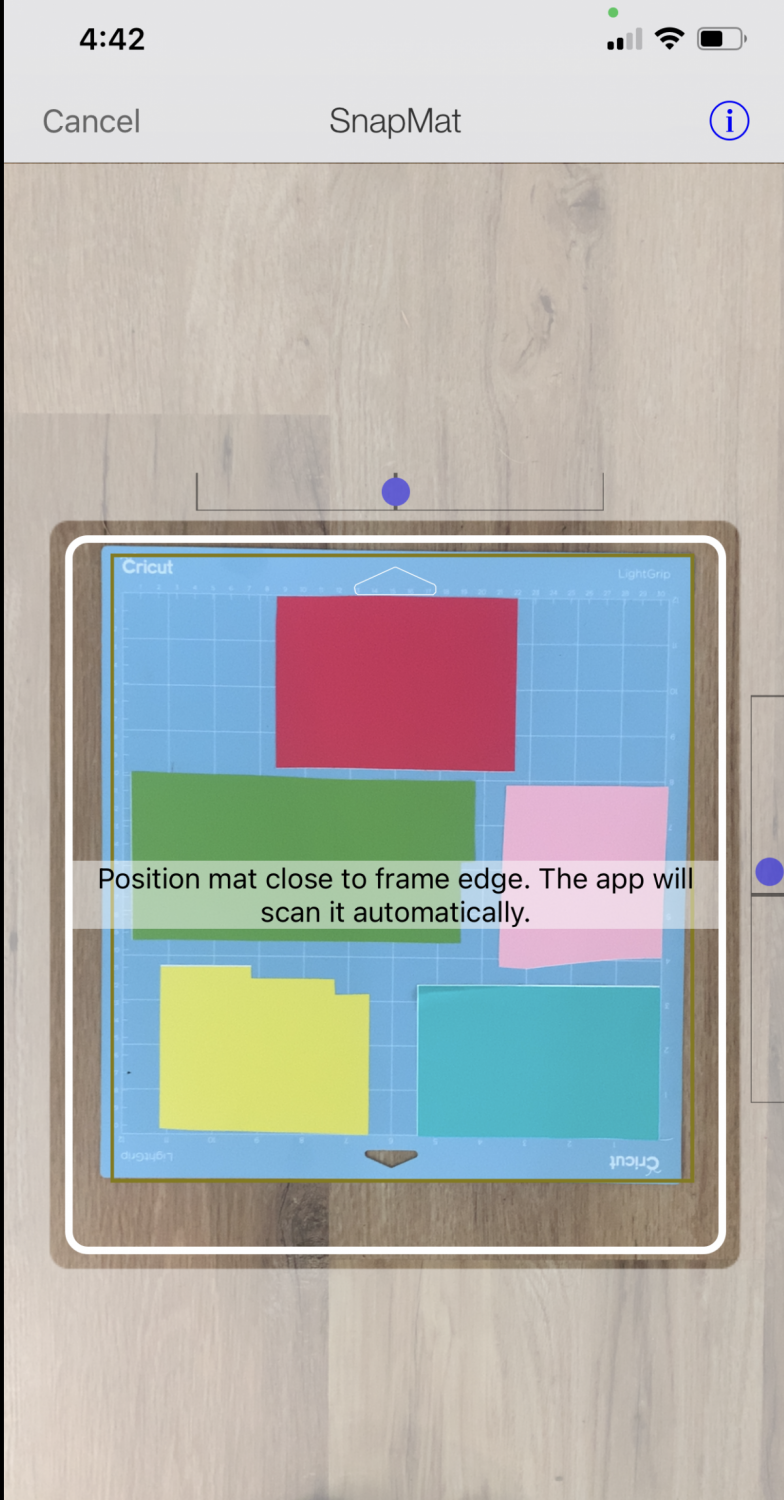 Cricut Design Space iOS: Camera focusing on mat sitting on the floor.