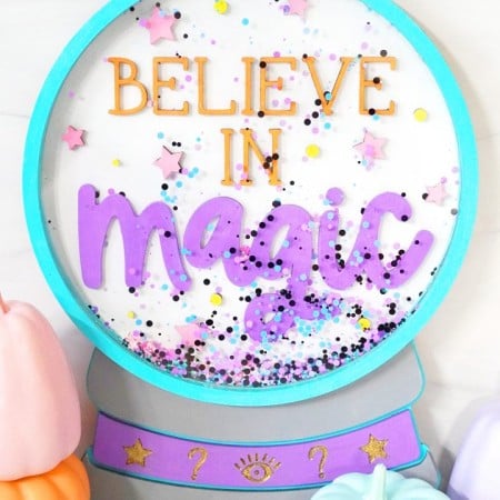 A crystal ball sign that says Believe in Magic