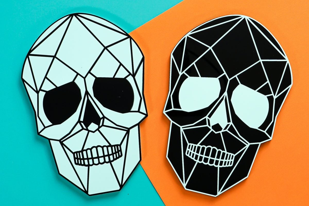 Two skulls on teal and orange background