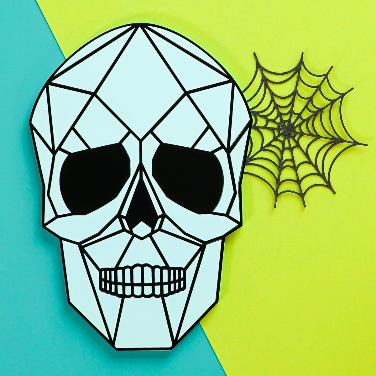 Light blue and black skull on teal and green background