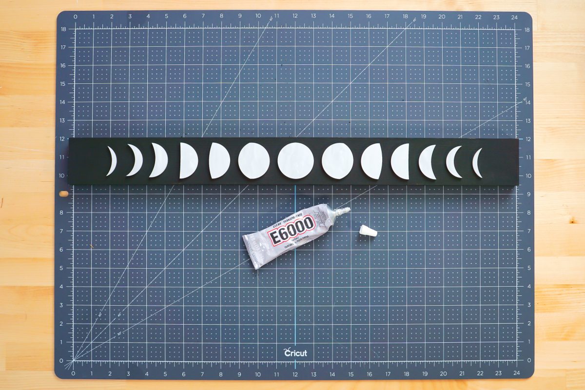 E6000 glue and moon pieces on board.