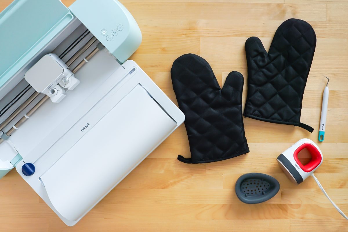 Supplies needed for this project: Cricut Explore 3, oven mitts, EasyPress Mini, weeding hook.