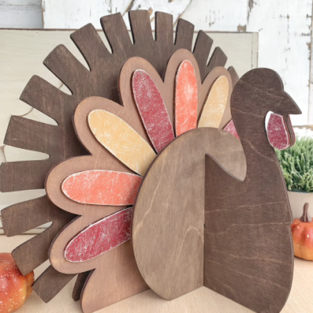 A turkey cut out of wood