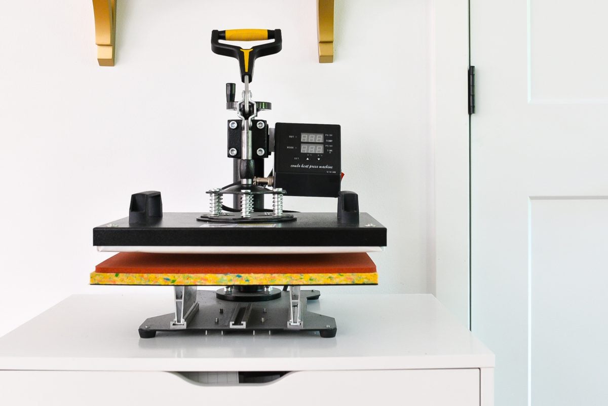 5-in-1 Heat Press sitting on IKEA Cabinet in front of white wall.