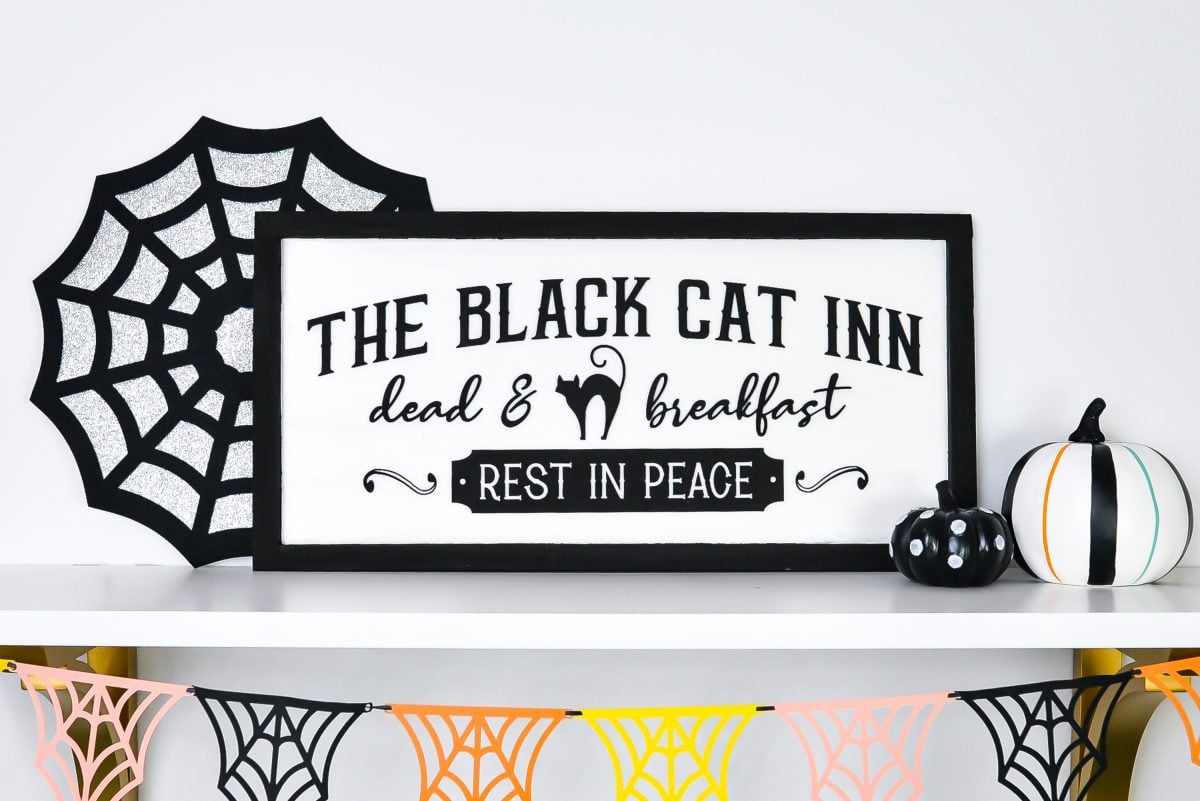 Vintage Halloween Sign: Black Cat Inn sign styled on shelf with Halloween decor