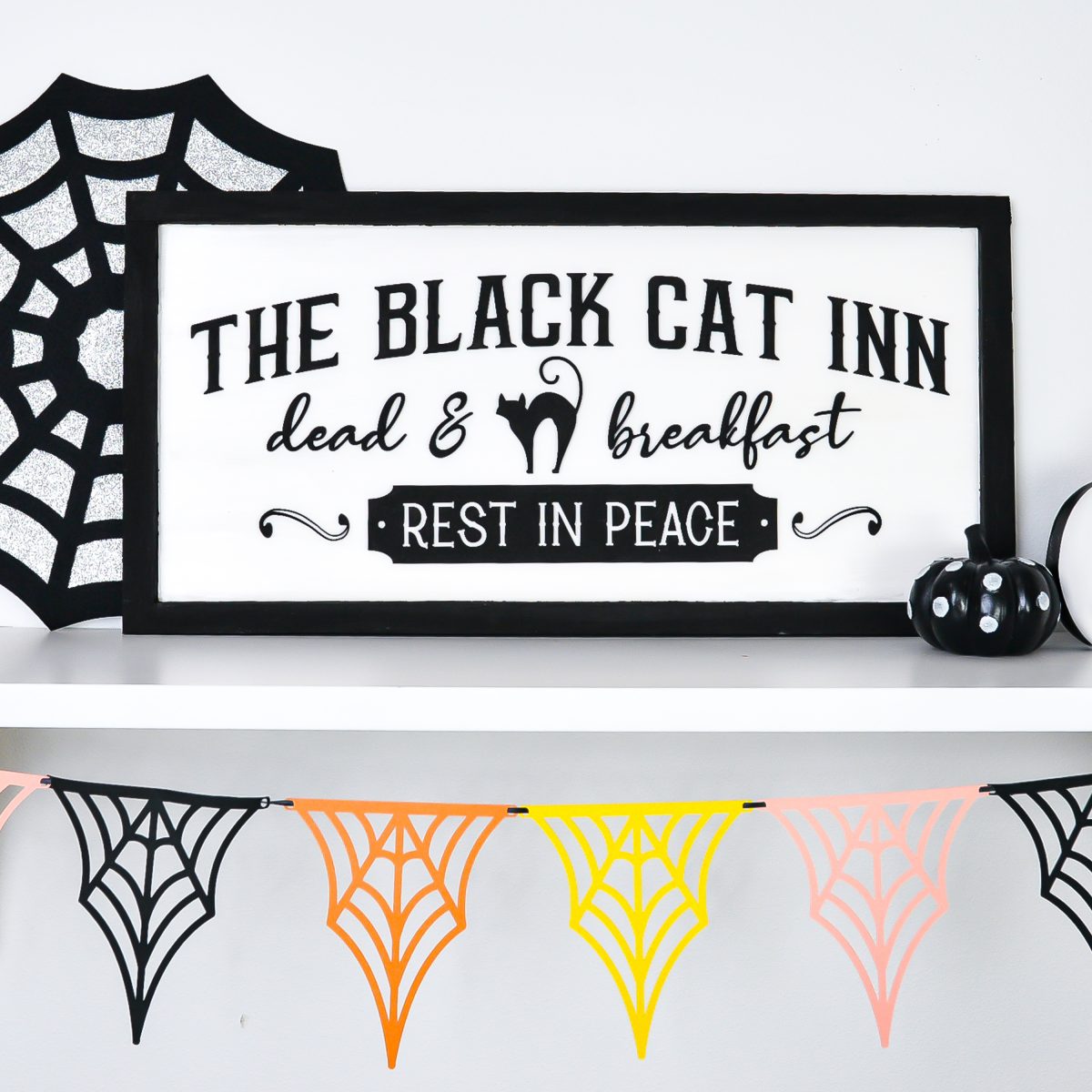 Vintage Halloween Sign: Black Cat Inn sign styled on shelf with Halloween decor