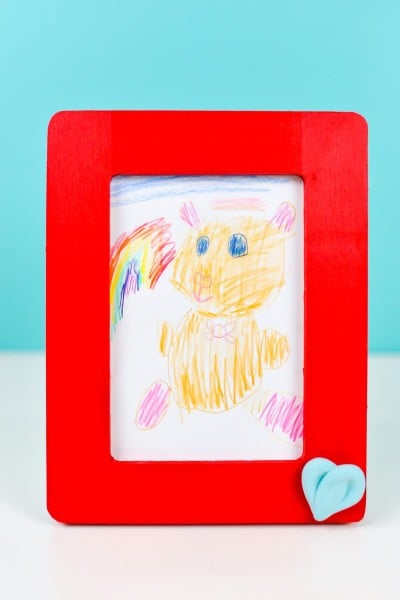 Framed children's artwork: a teddy bear. Red Frame.