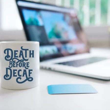 White coffee cup that says Death Before Decaf