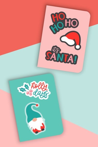 Christmas stickers on teal and pink notebooks