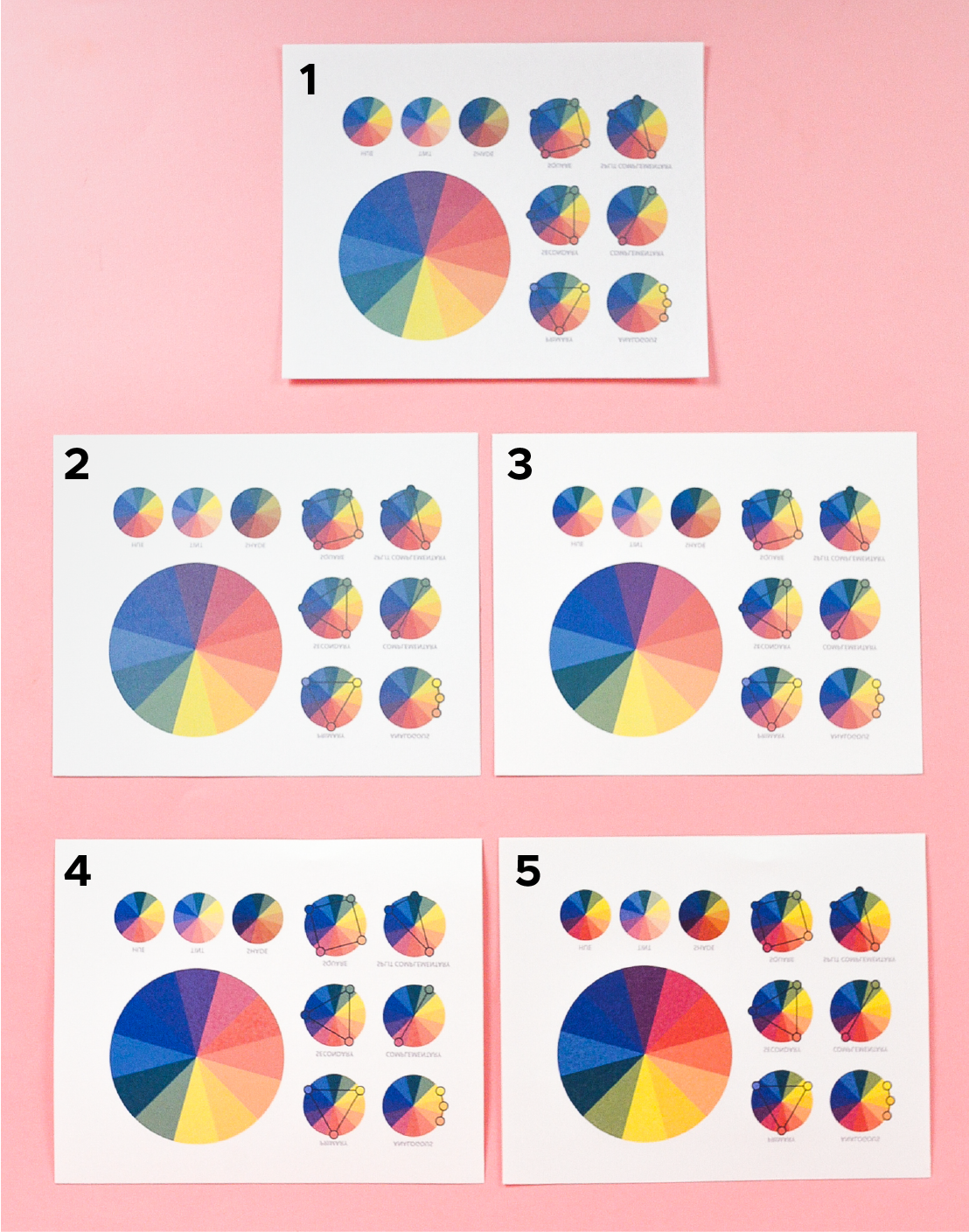Five color wheels printed with five different papers.