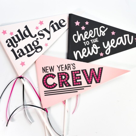 Three New Year's Eve pennants that say, Auld Lang Syne, Cheers to the New Year and New Year's Crew