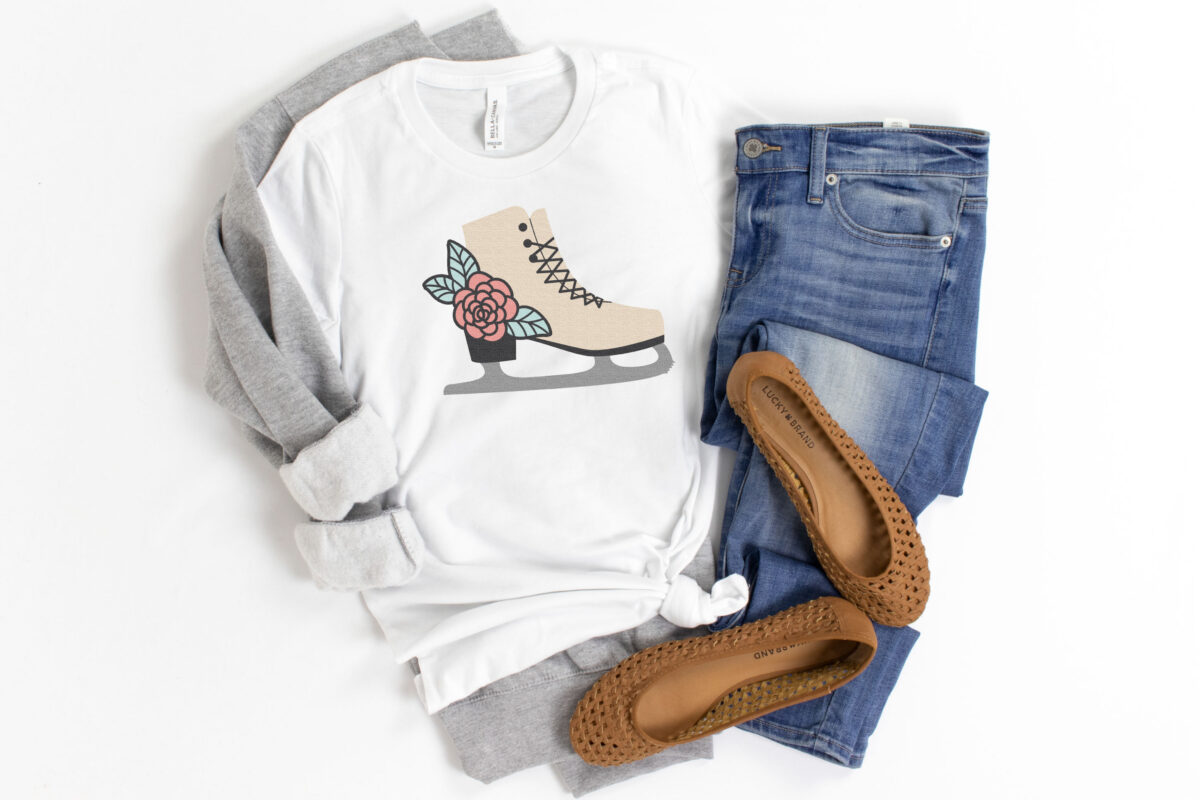 Figure Skating SVG on a white shirt with a gray sweatshirt and jeans