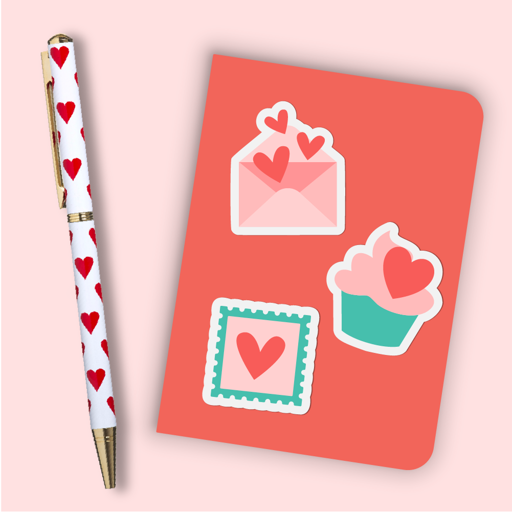 Notebook with Valentine's Day stickers and a pen with hearts on it
