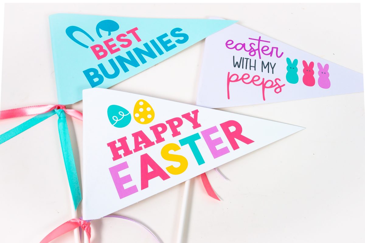 Three of the printable easter pennants on a white table.