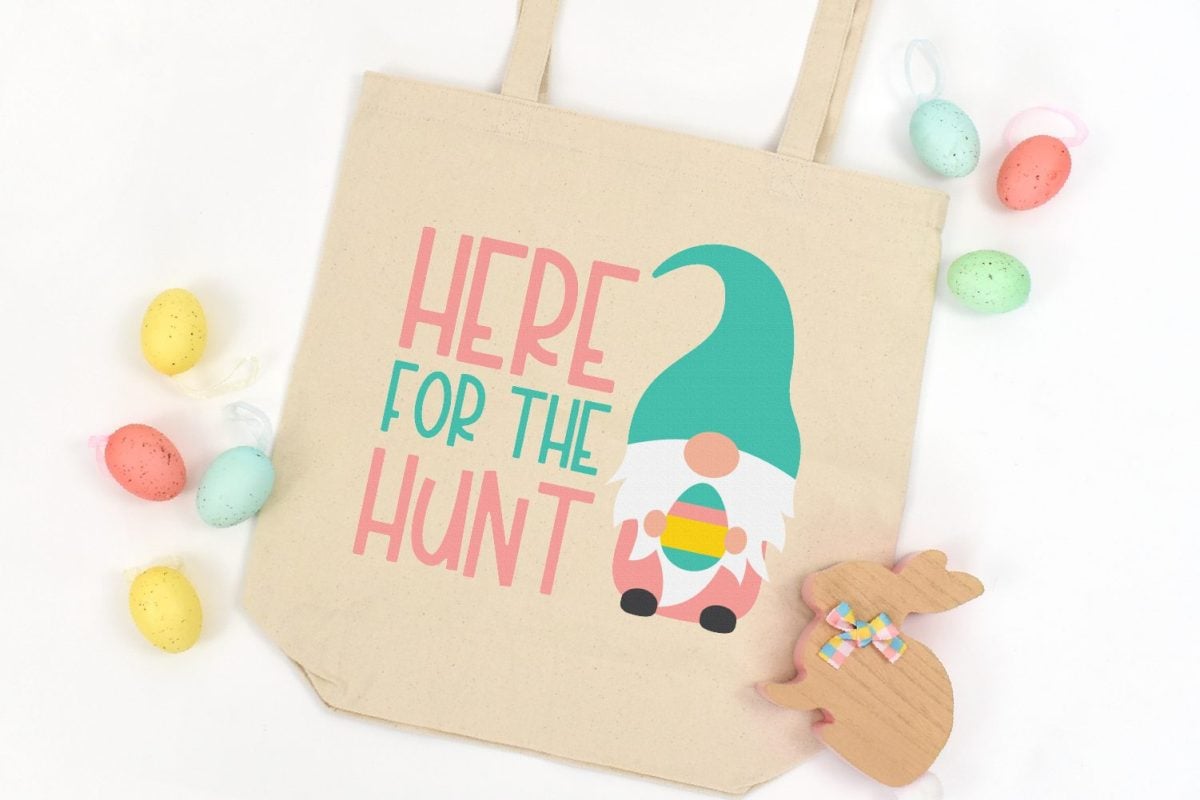 Tote bag with an image of a gnome on it and the saying Here for the Hunt