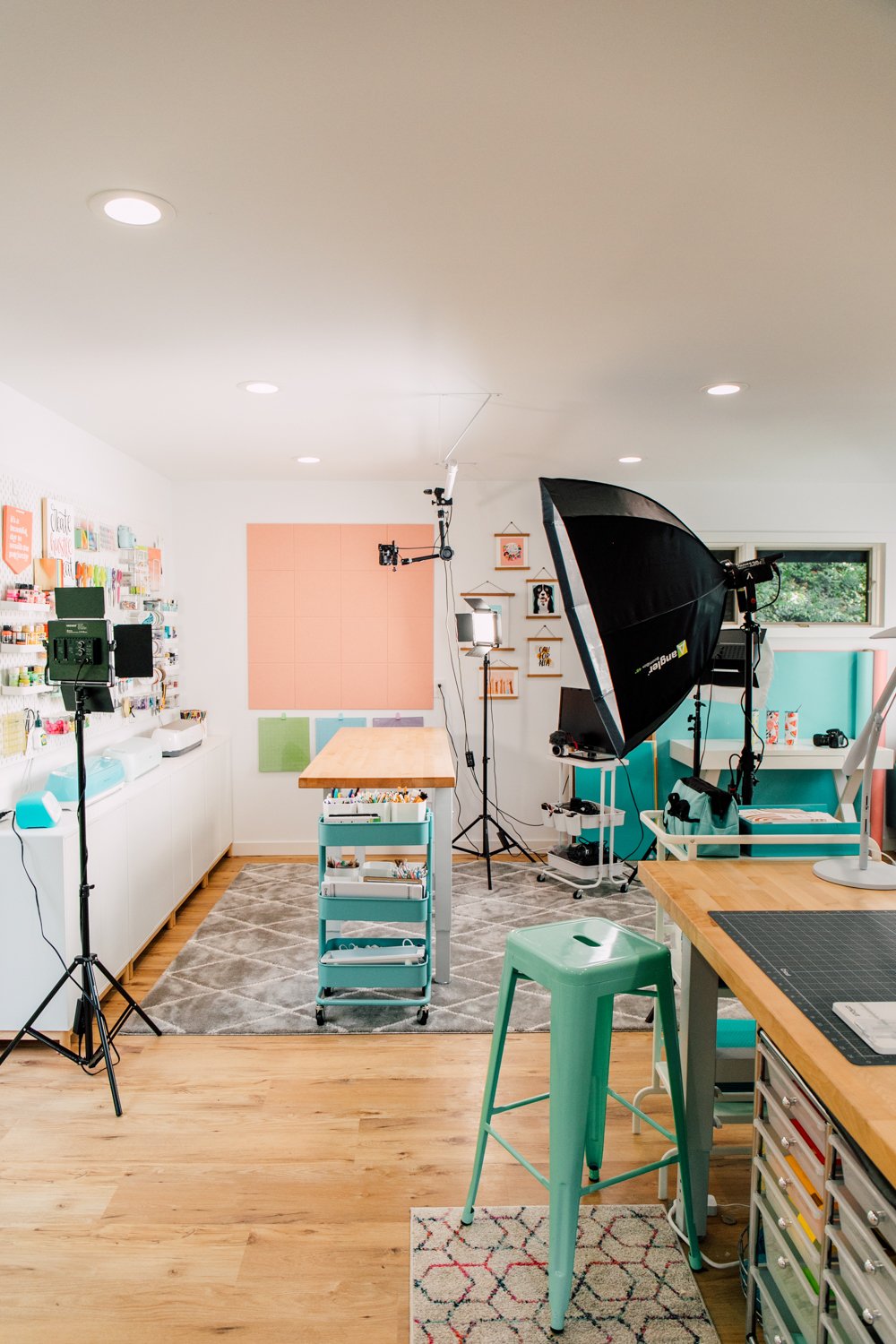 Wide view of filming area showing lights set up and camera above desk.