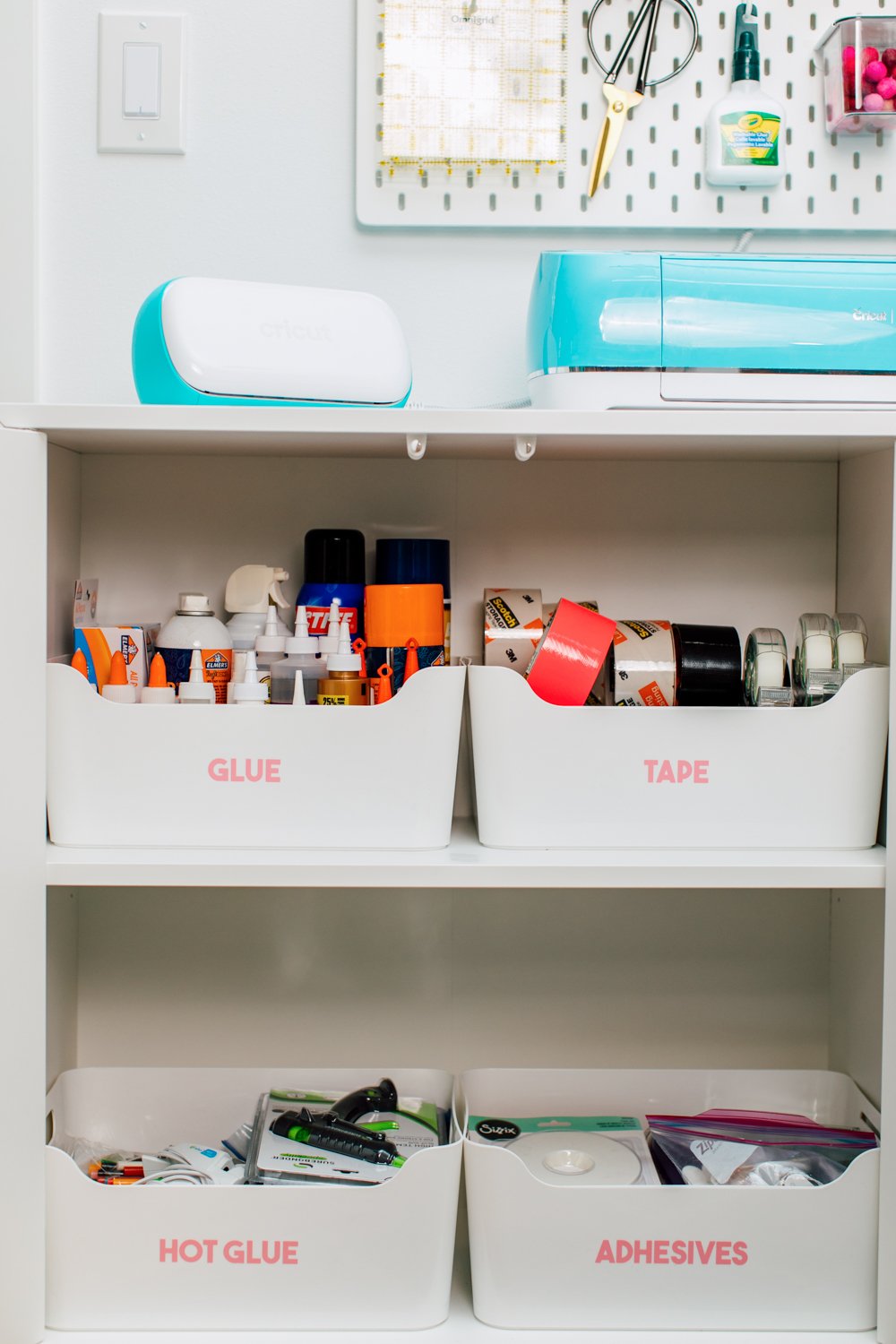 Eket cabinet with glue, tape, hot glue, and adhesives