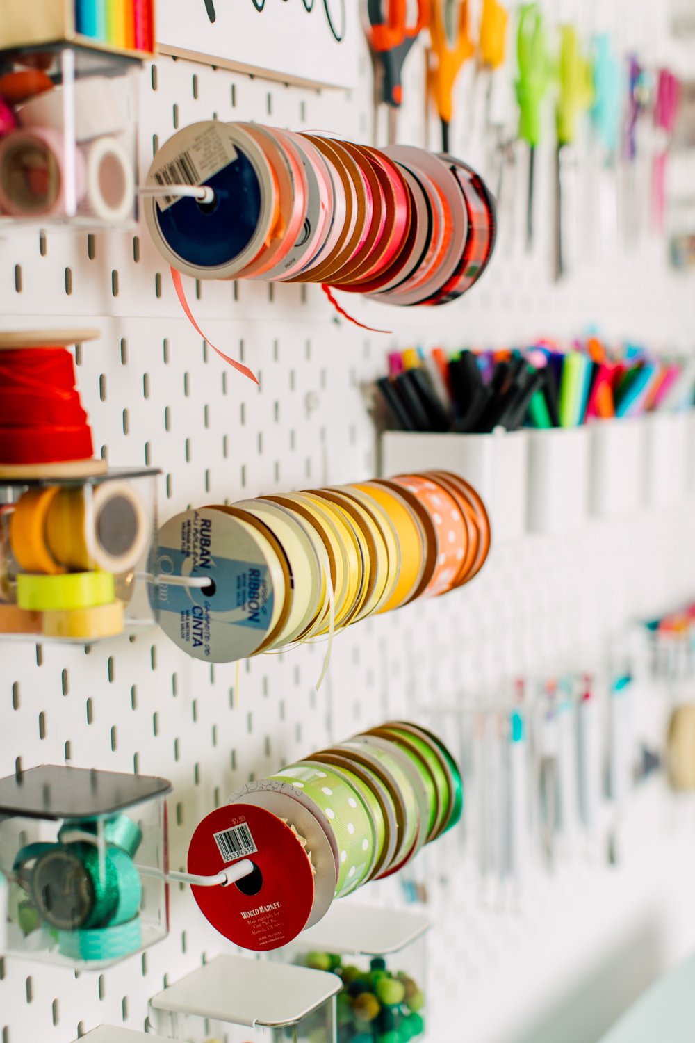 Close up of ribbons on a pegboard