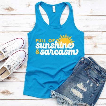 Blue tank top with an image of the sun on it along with the words Full of Sunshine and Sarcasm