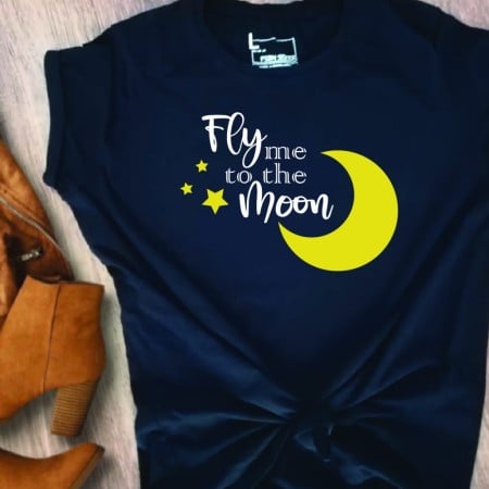 Black t-shirt with image of moon and stars and the words Fly Me to the Moon