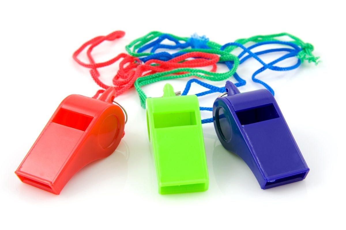 Three plastic whistles