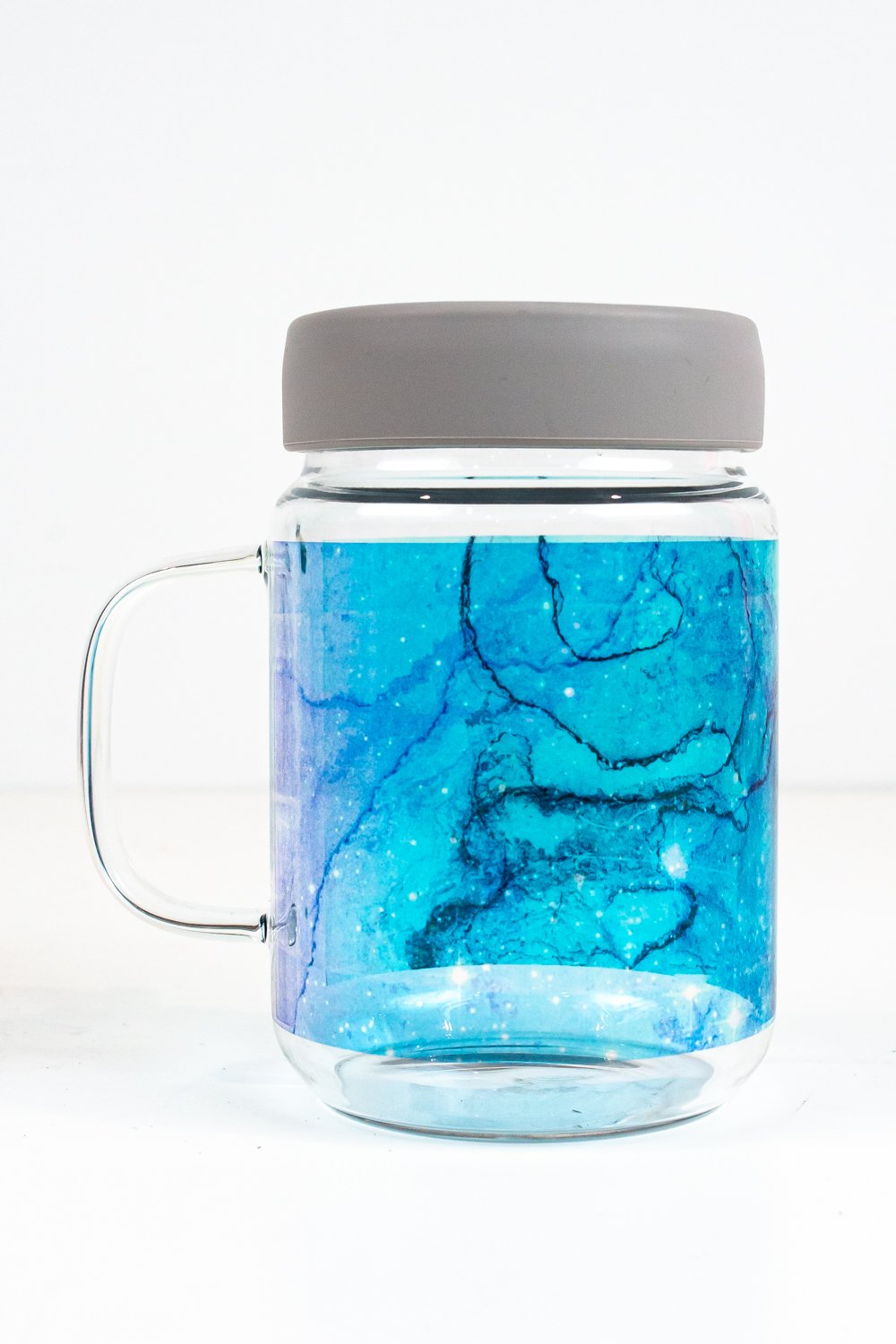 Sublimation mason jar mug with blue galaxy image.
