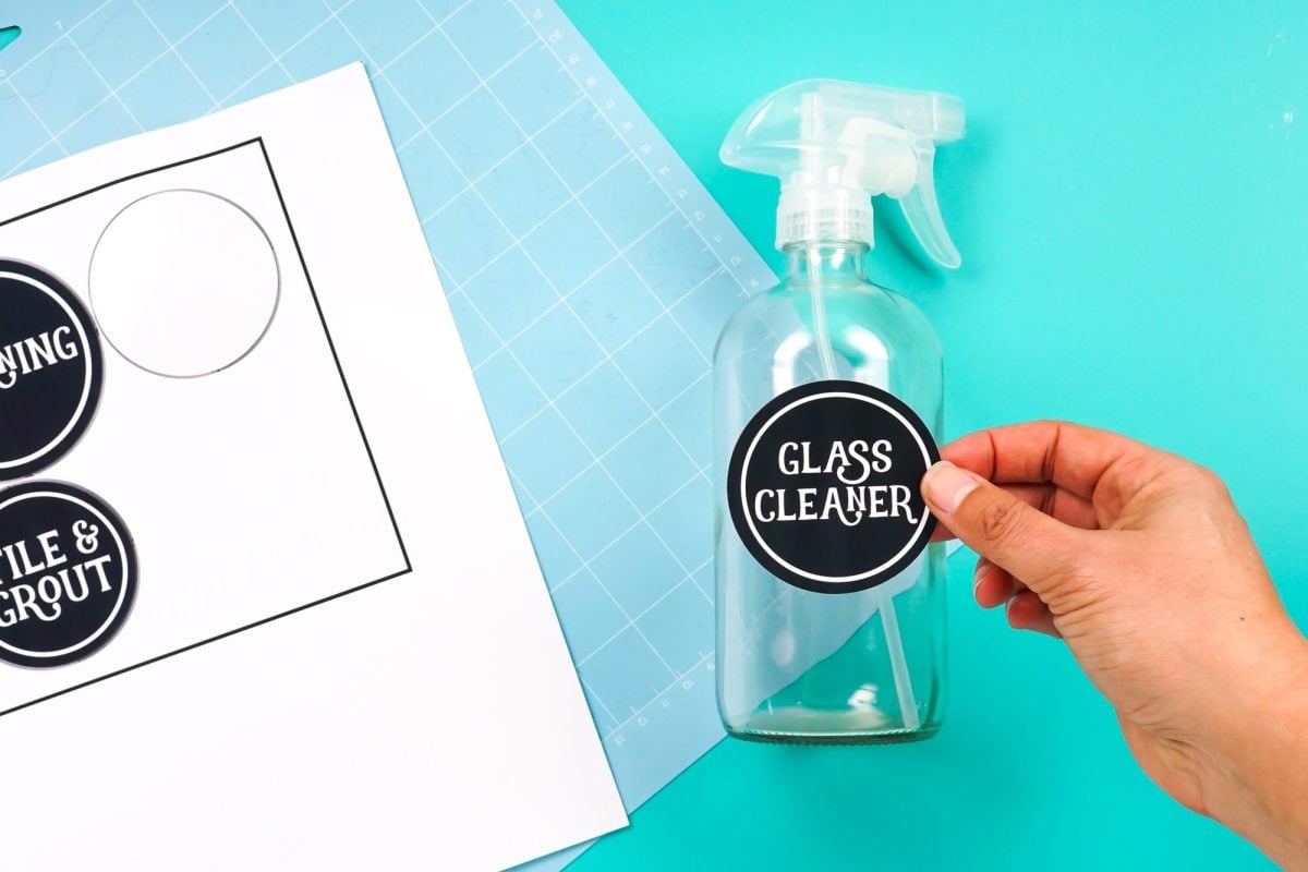 Hand holding a Glass Cleaner sticker