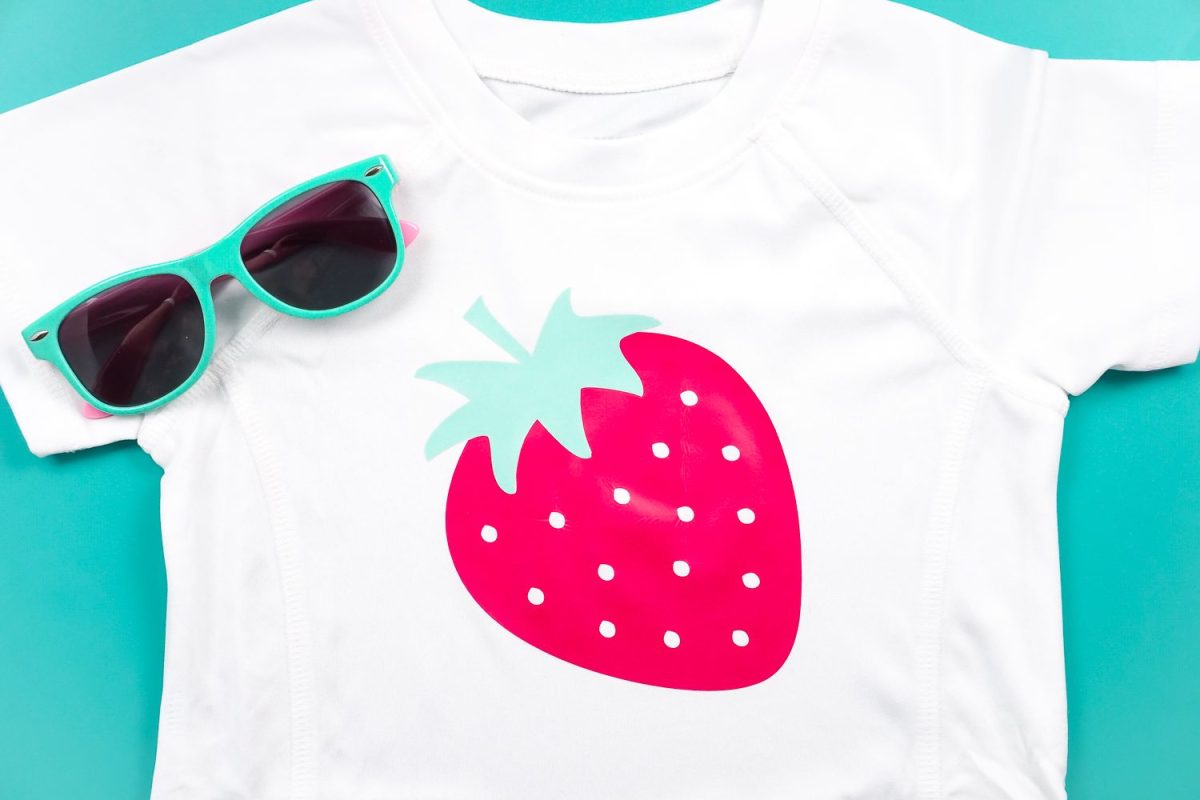 Strawberry decal on a kid's rash guard top.
