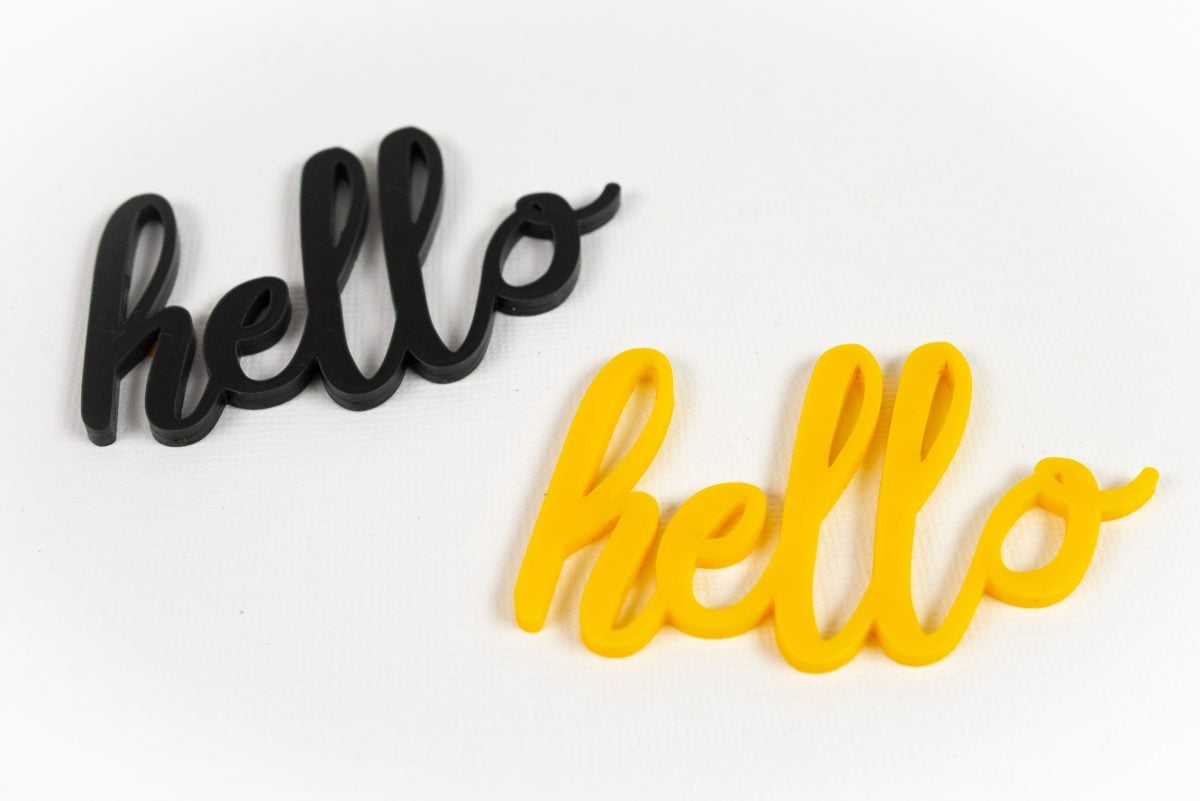 Hello cut from black and yellow acrylic