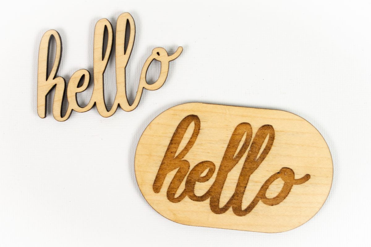 Hello cut out of maple and engraved on maple shape.