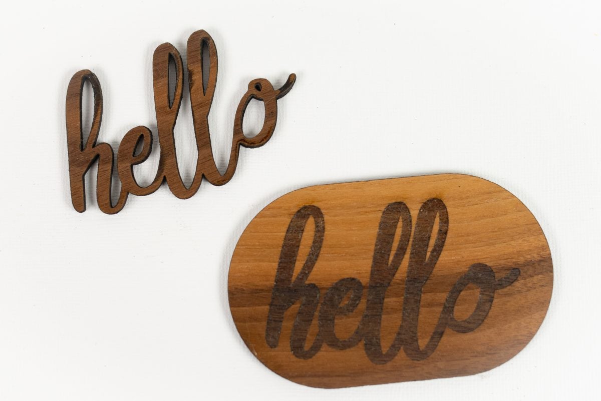 Hello cut out of walnut and engraved on walnut shape.